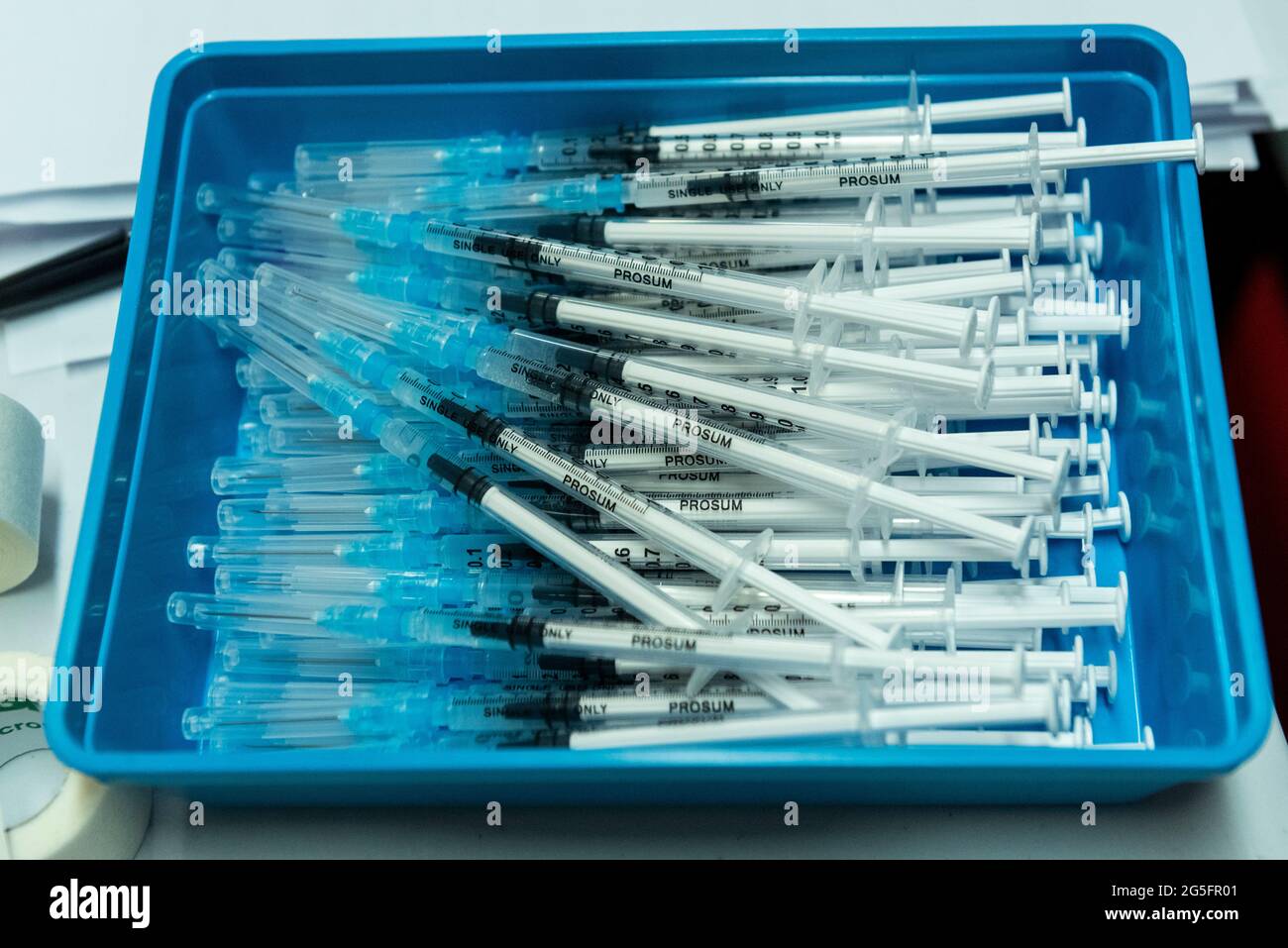 Watford, UK.  27 June 2021.  Syringes prepared with the Pfizer vaccine at a pop-up mass vaccination clinic at Watford FC’s Vicarage Road Stadium as part of the “Grab a jab” campaign. The NHS is also promoting a number of walk-in clinics this weekend across the capital to try to increase the number of over 18s receiving a jab as cases of the Delta variant are reported to be on the rise.  Credit: Stephen Chung / Alamy Live News Stock Photo