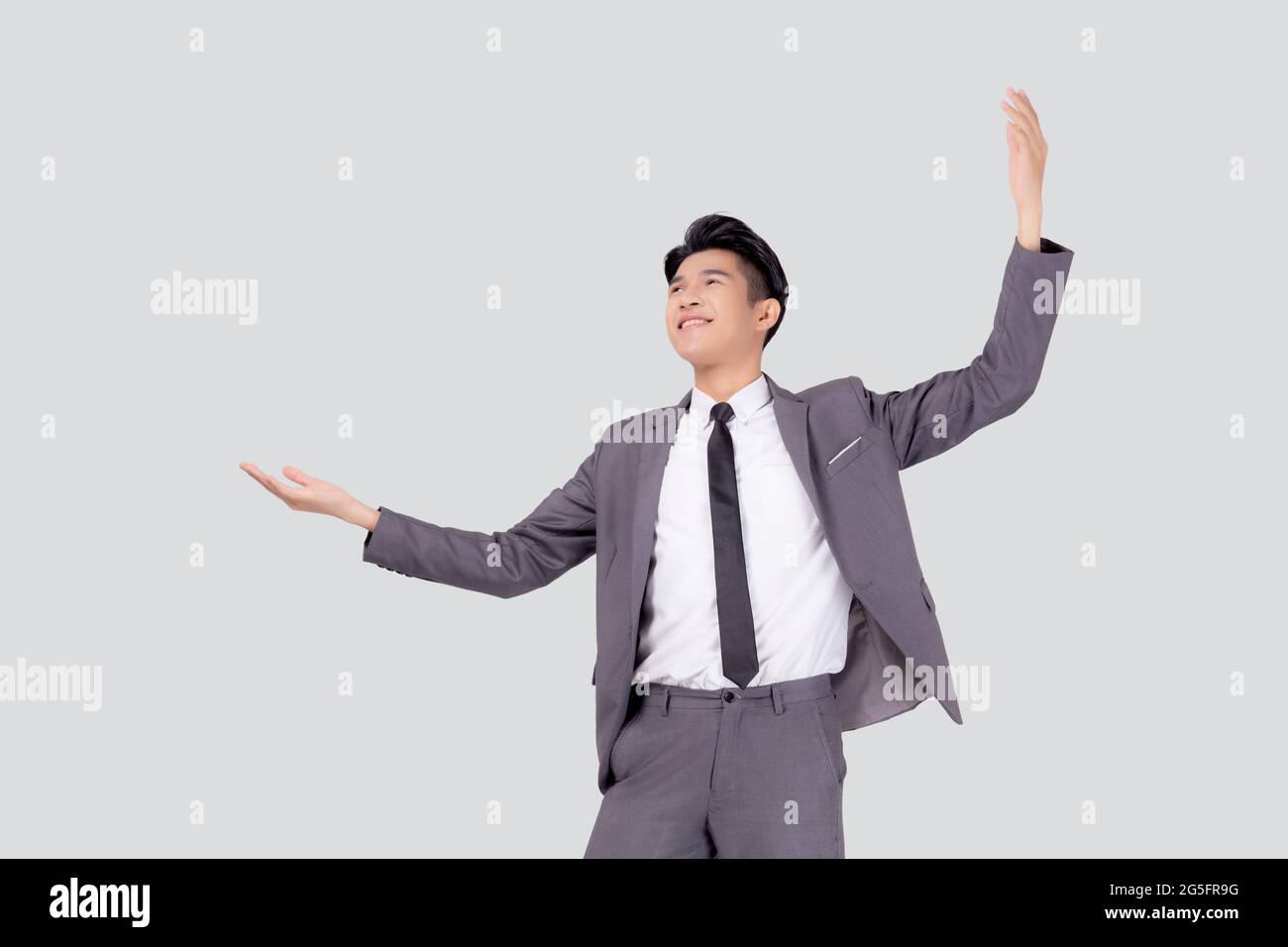 Portrait businessman in suit standing with win success isolated on ...