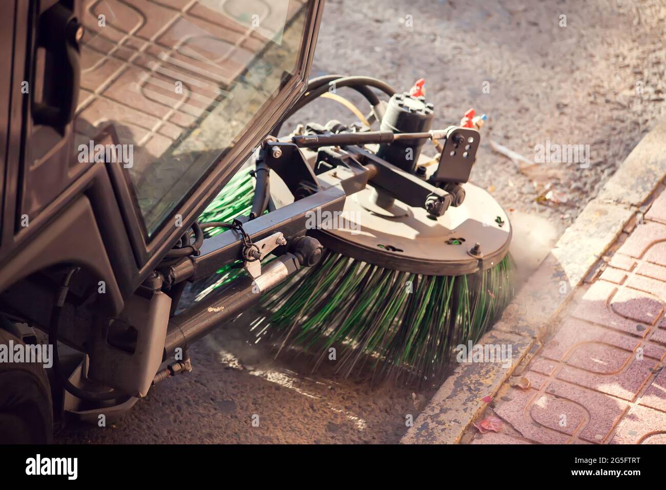 Street cleaning machine with truck brushes. Close up shot. Stock Photo