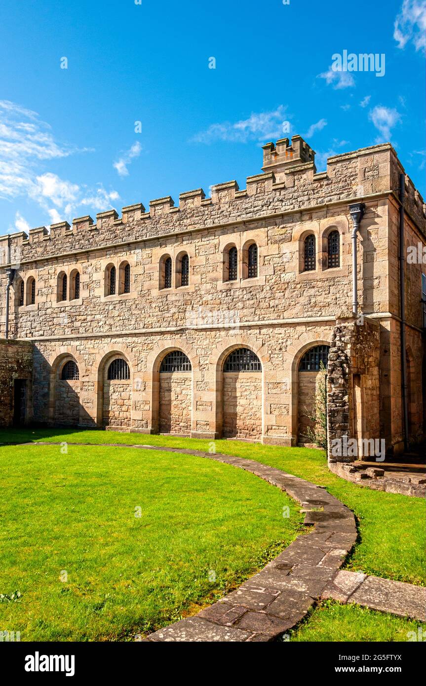 The rear 0f Brideswell prison block at Jedburgh old jail has a large part of the retention wall missing from the exercise yard at the cell block end Stock Photo