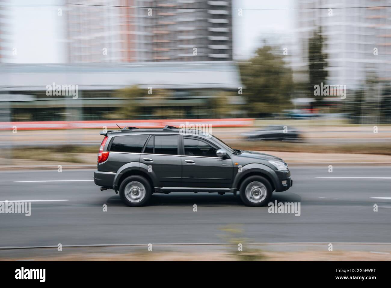 Ukraine, Kyiv - 29 April 2021: Black Great Wall Hover car moving on the street. Editorial Stock Photo