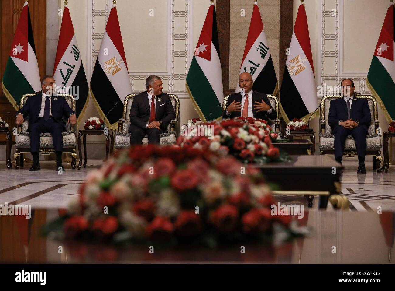 Baghdad, Iraq. 27th June, 2021. (L-R) Iraqi Prime Minister Mustafa Al ...