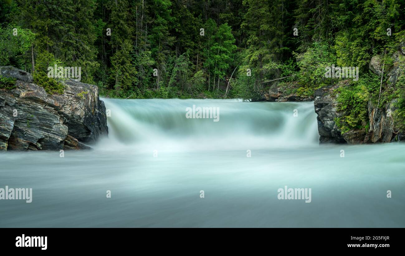 Long exposure creating a silky look of Overlander Falls on the Fraser River in Mount Robson Provincial Park in the Canadian Rockies, British Columbia, Stock Photo