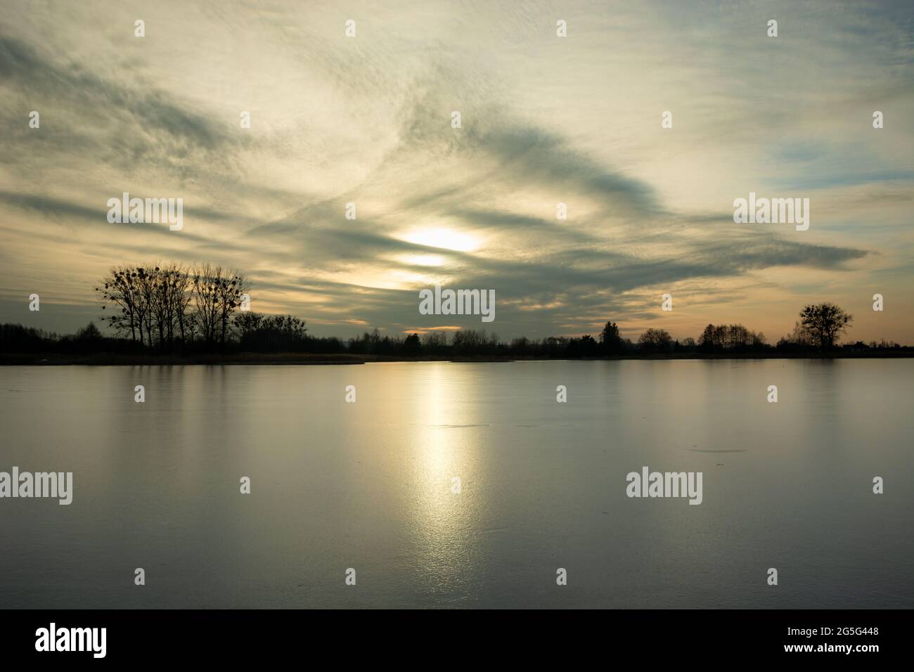 A frozen lake and sunshine on the ice sheet, Stankow, Lubelskie, Poland Stock Photo