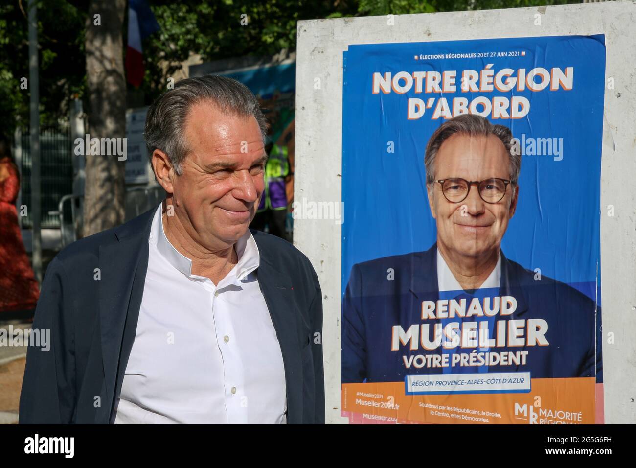 Marseille, France. 27th June, 2021. The president of the Provence region, Renaud Muselier, walks past his electoral poster during the second round of the regional elections.The president of the Provence region, Renaud Muselier, who came second in the first round of regional elections in France, votes in the second round. Credit: SOPA Images Limited/Alamy Live News Stock Photo