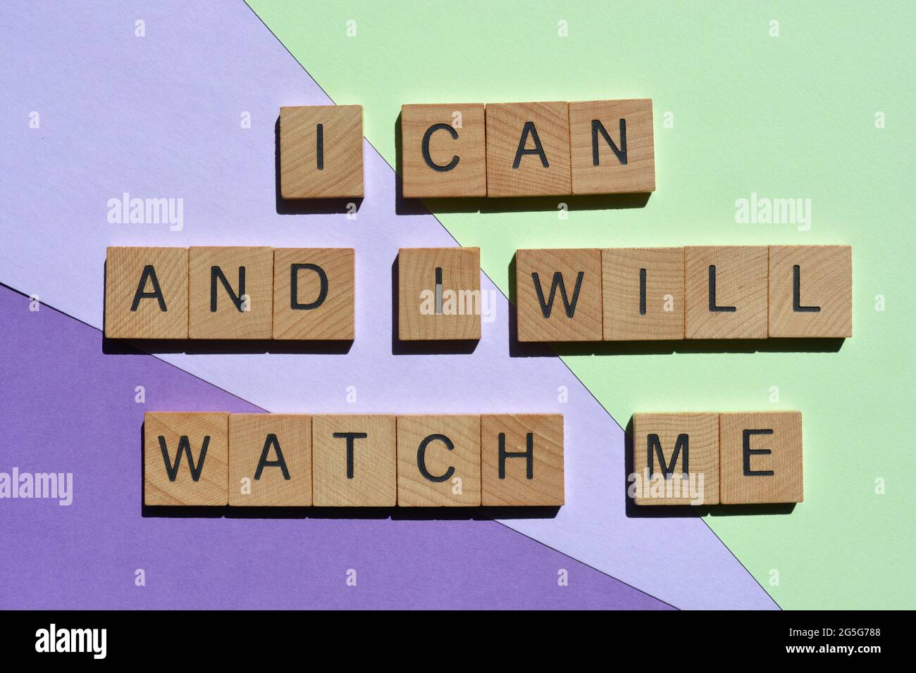 I Can and I will, Watch Me. Motivational phrase in wooden alphabet letters isolated on colourful background Stock Photo