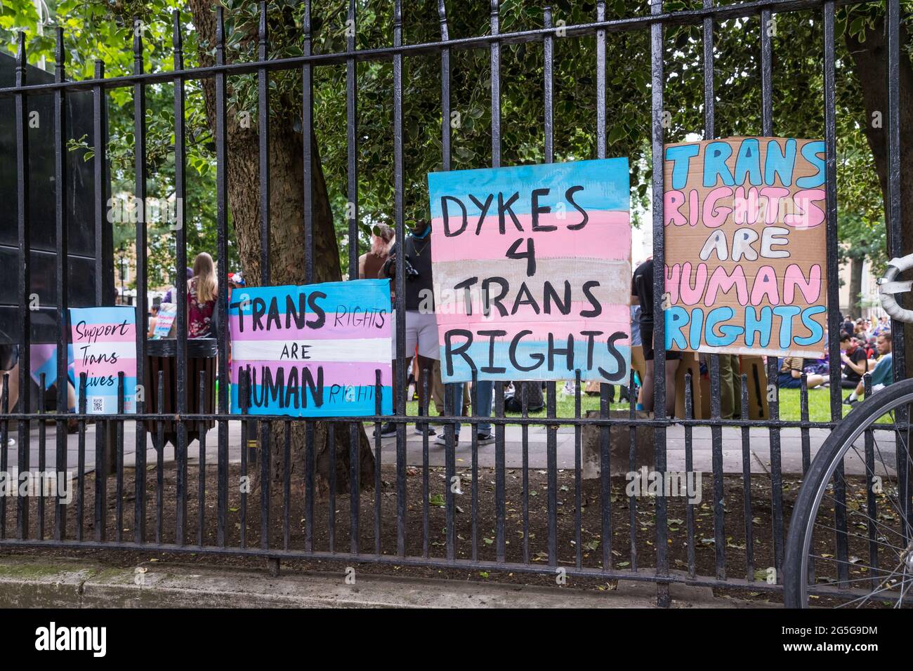 Placards on a railing at the third edition of London Trans Pride Stock Photo