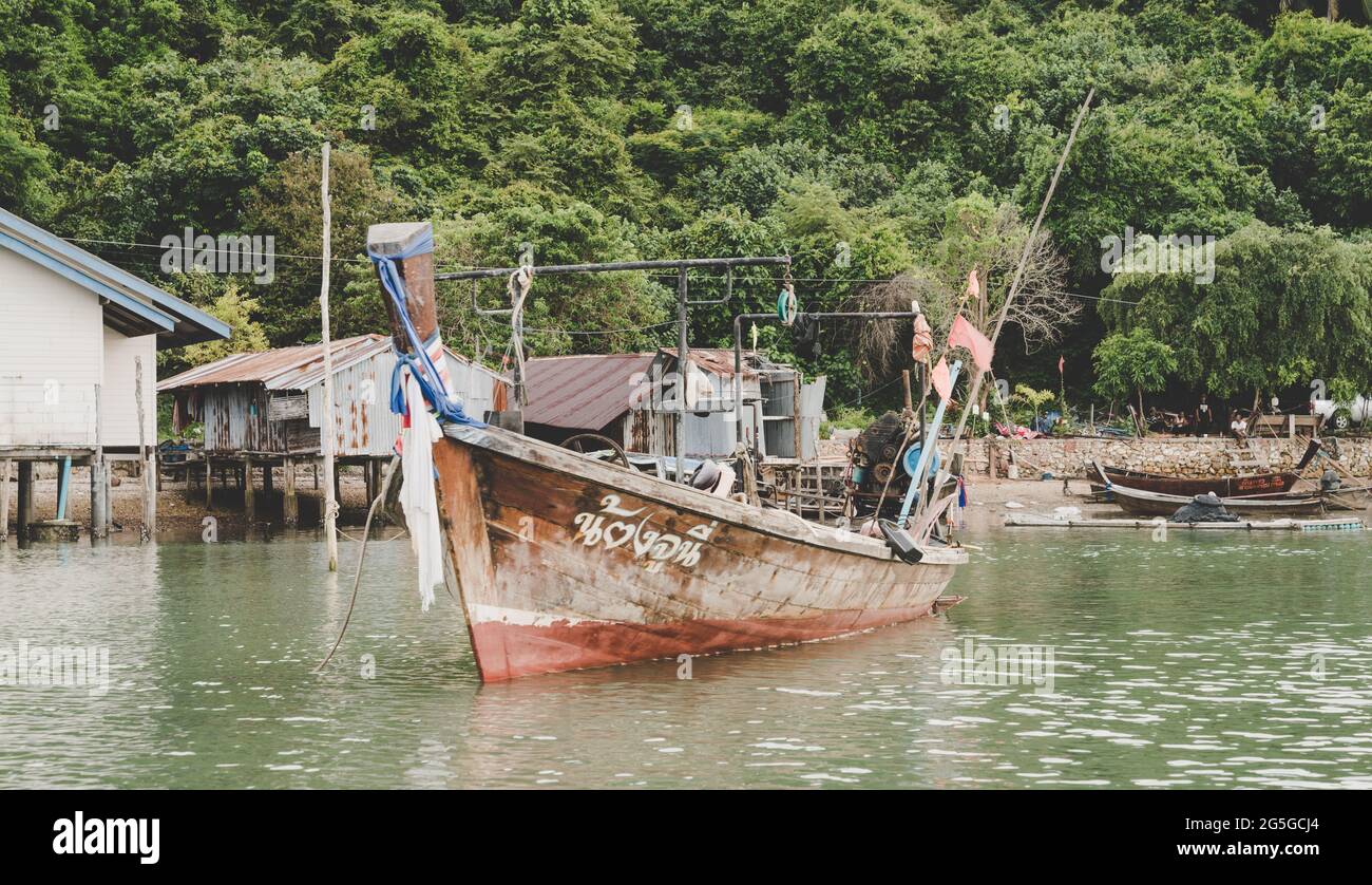 Traditional Thai long tail boat at a fishing village on Ko Yao Yai island Stock Photo
