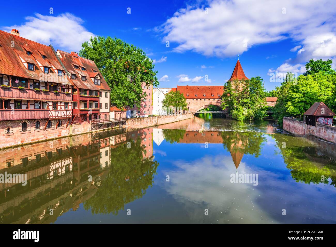 Nuremberg, Germany. Colourful and picturesque view of the Schlayerturm on the banks of the Pegnitz river. Tourist attractions in Franconia, Bavaria. Stock Photo