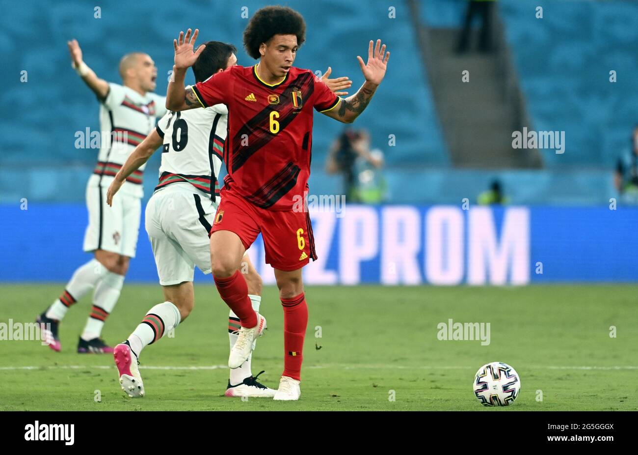 Portugal's Joao Palhinha and Belgium's Axel Witsel react during the round of 16 game of the Euro 2020 European Championship between the Belgian nation Stock Photo