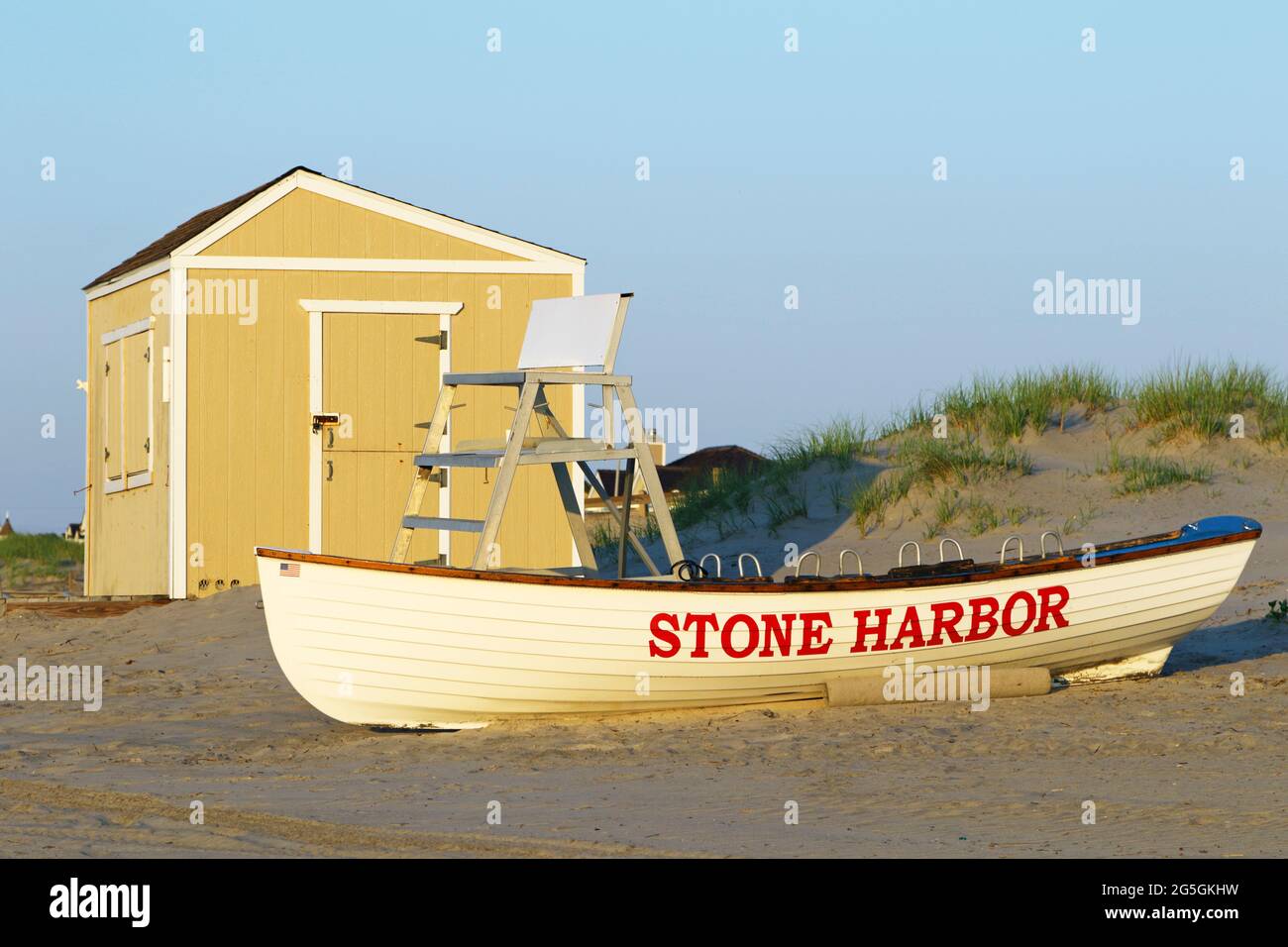 A Stone Harbor lifeboat on the beach ready for the days activities. Stone Harbor is a popular seaside resort on Seven Mile Island in Cape May County Stock Photo
