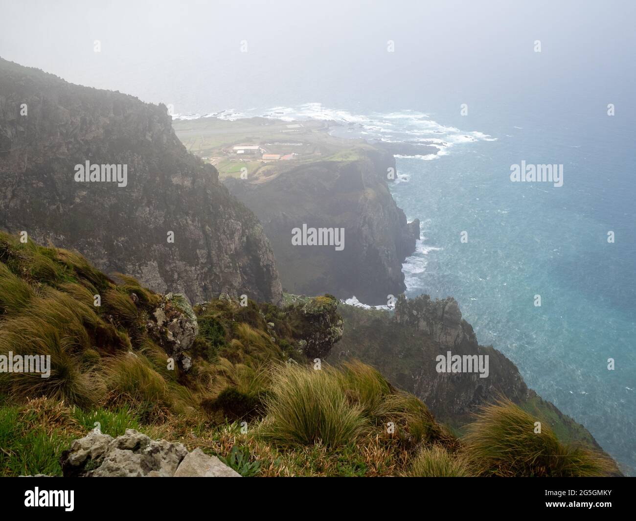 Looking from above the cliffs at the sea in Corvo Island, Azores Stock Photo