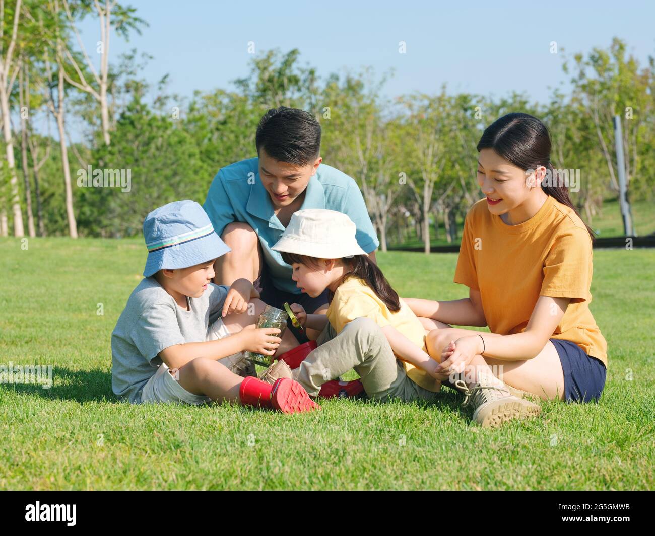 Happy family of four playing in the park high quality photo Stock Photo ...