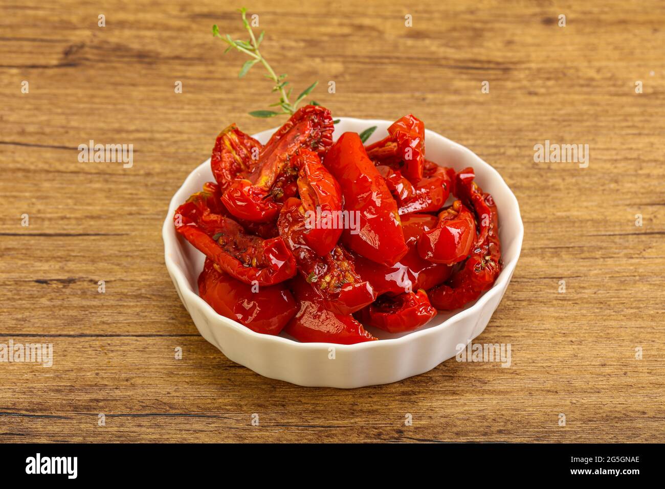 Sundried tomato in olive oil with herbs and spices Stock Photo Alamy
