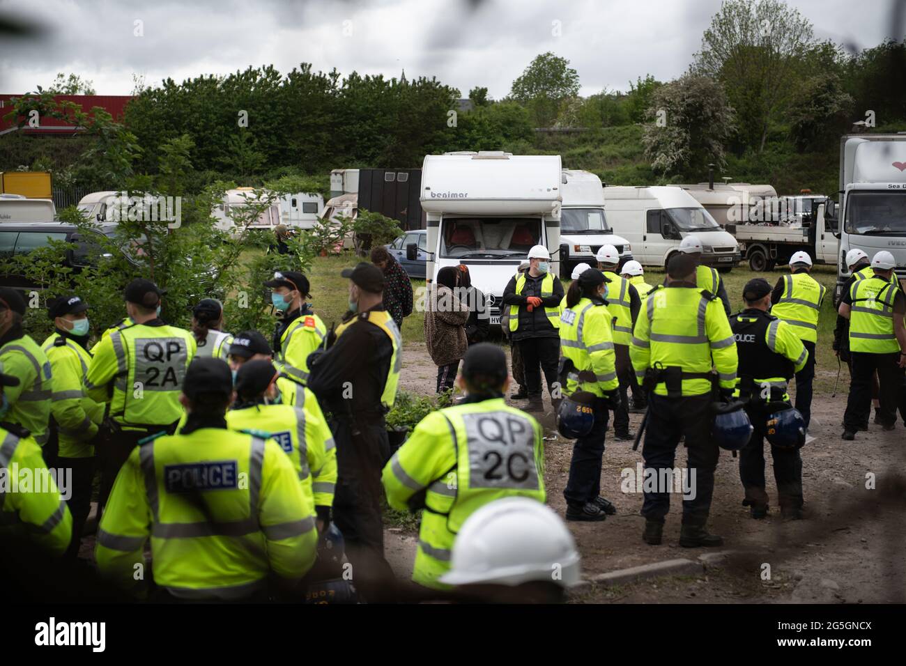 Eastville, Bristol, UK. 20th May 2021. Scores of police and bailiffs have surrounded a traveller encampment in Bristol to evict occupiers. Stock Photo