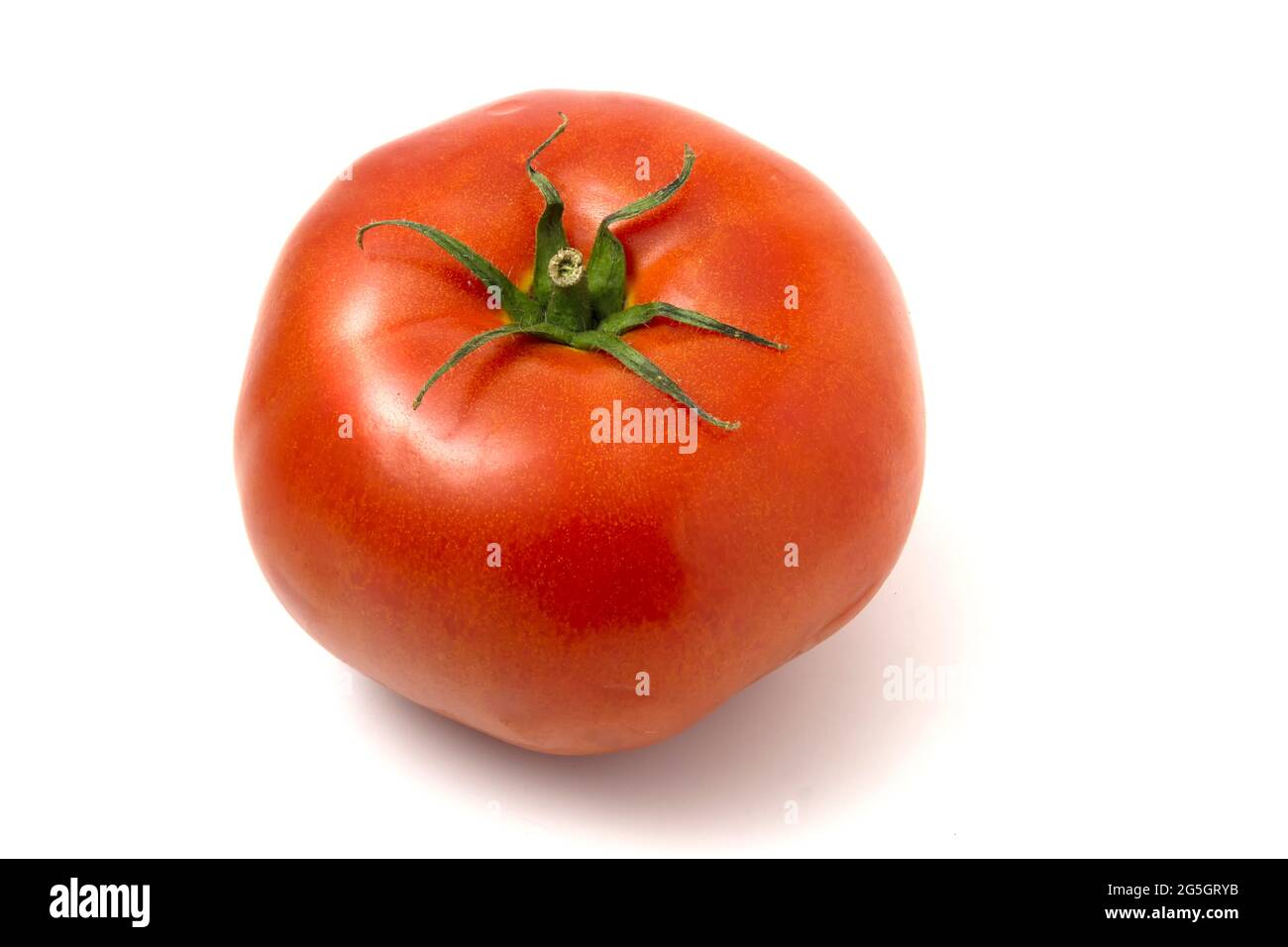 One fresh red tomato isolated on white. Stock Photo