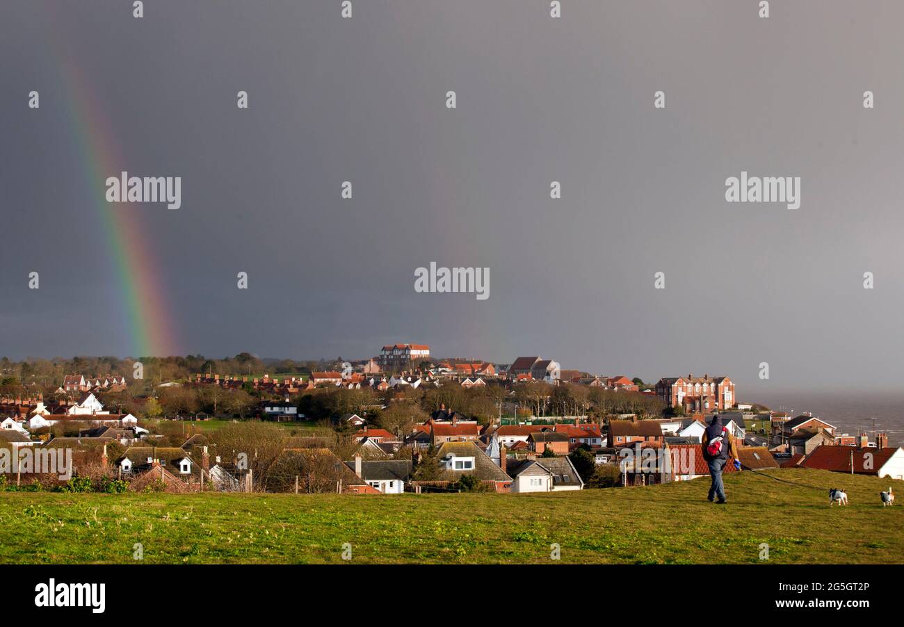 A rainbow over the village of  Mundesley on the North Norfolk coast, England.  image taken April 2021 Stock Photo