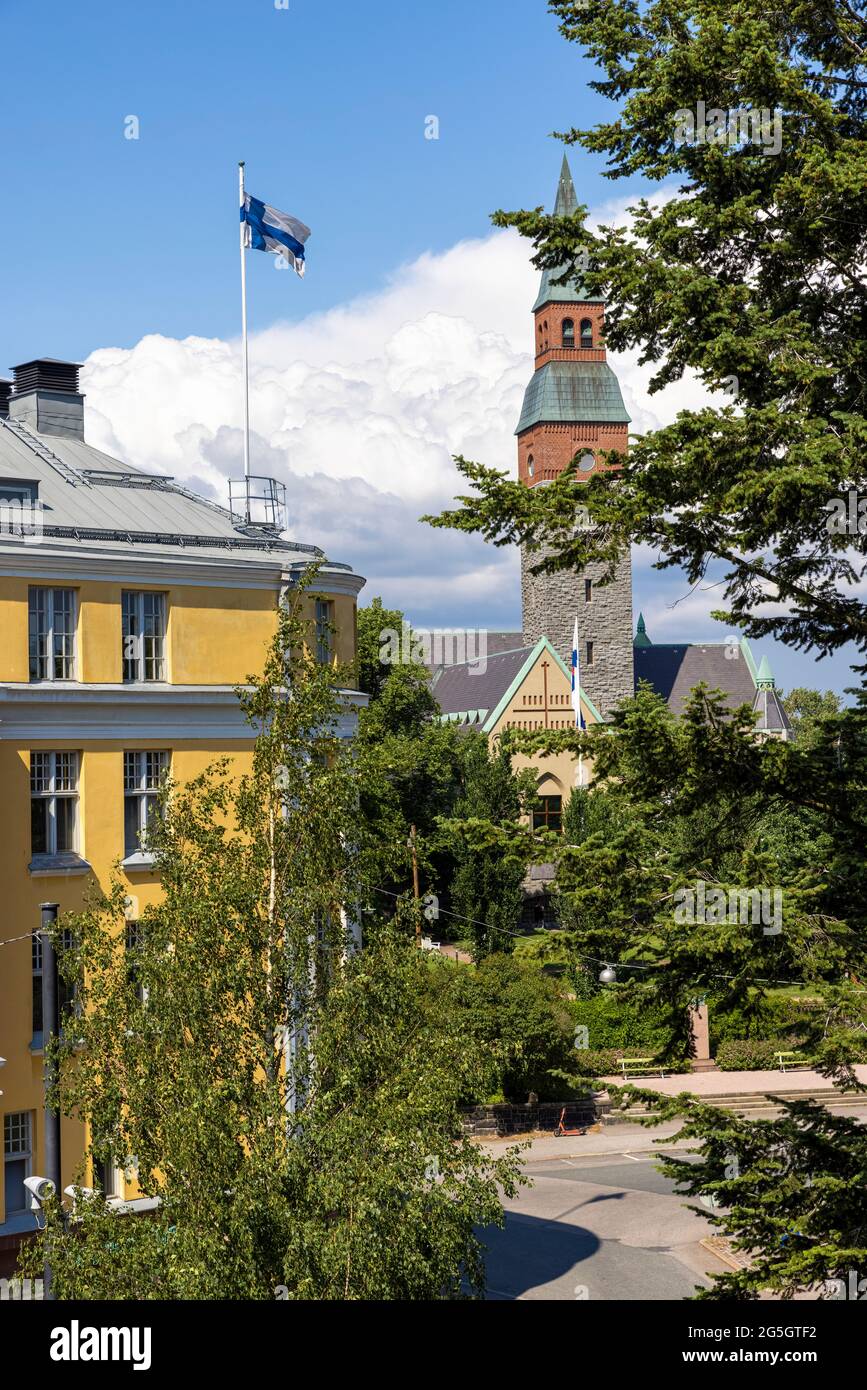 Finnish flag flying high over residential building in Helsinki Stock Photo