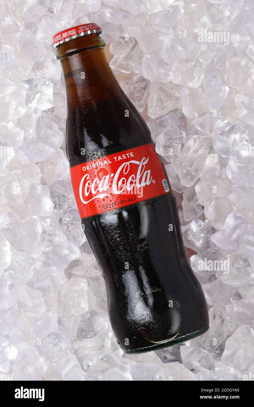 IRVINE, CALIFORNIA - 26 JUNE 2021: A glass bottle of Coca-Cola in a bed of ice. Stock Photo