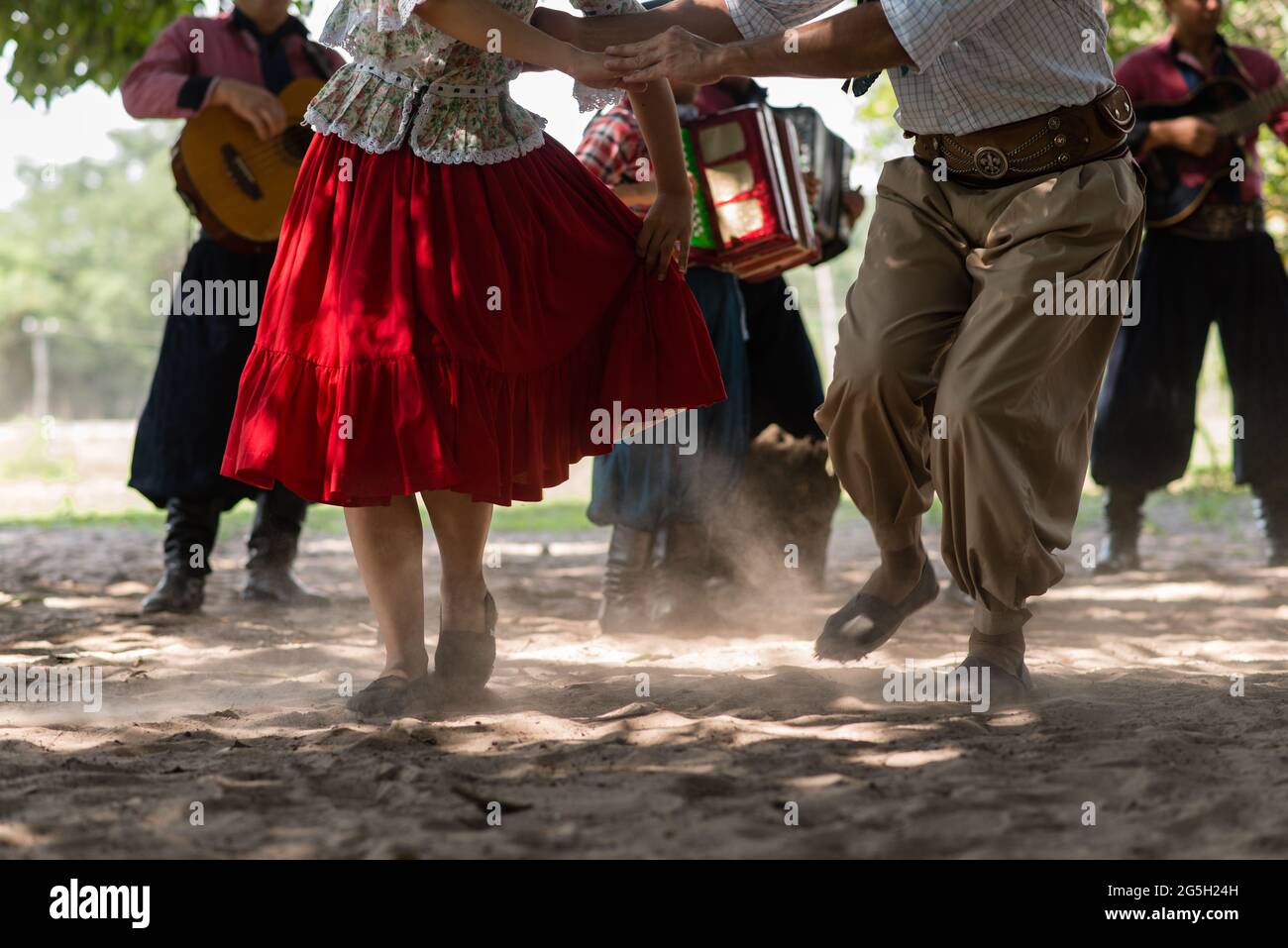 People and couples dancing and playing CHAMAME at countryside in Corrientes, Argentina. Stock Photo
