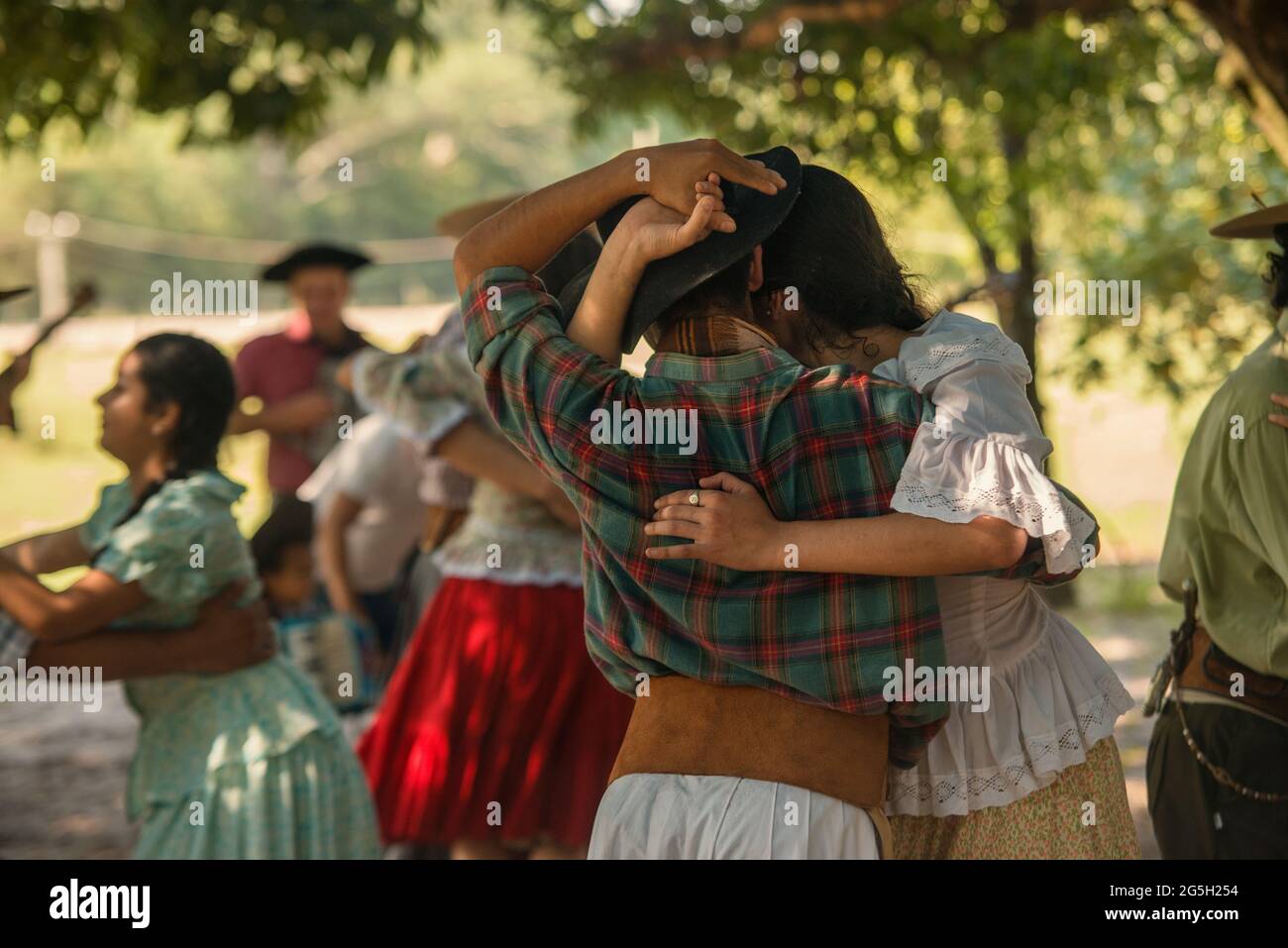 People and couples dancing and playing CHAMAME at countryside in Corrientes, Argentina. Stock Photo