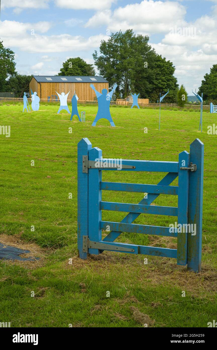 Blue figures in a field Stock Photo