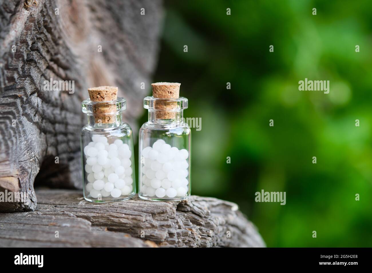 Two bottles of homeopathy globules. Bottles of homeopathic granules. Homeopathy medicine concept. Stock Photo