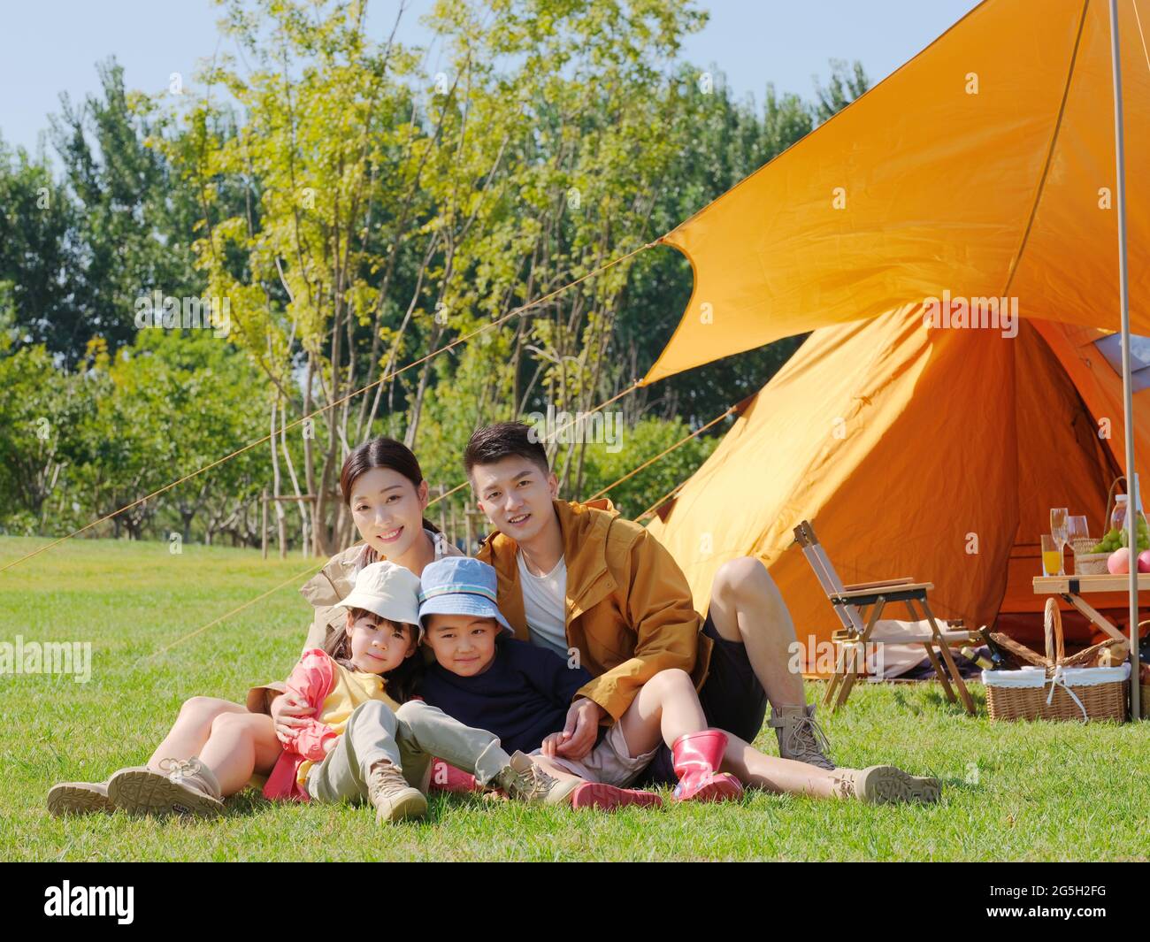 Happy family of four in the park high quality photo Stock Photo - Alamy