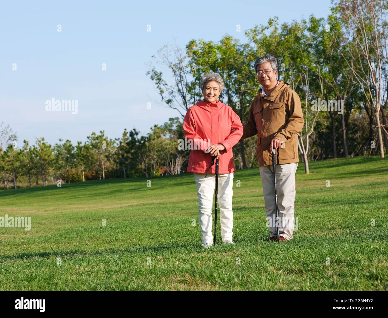 Happy old couple walking in the park high quality photo Stock Photo