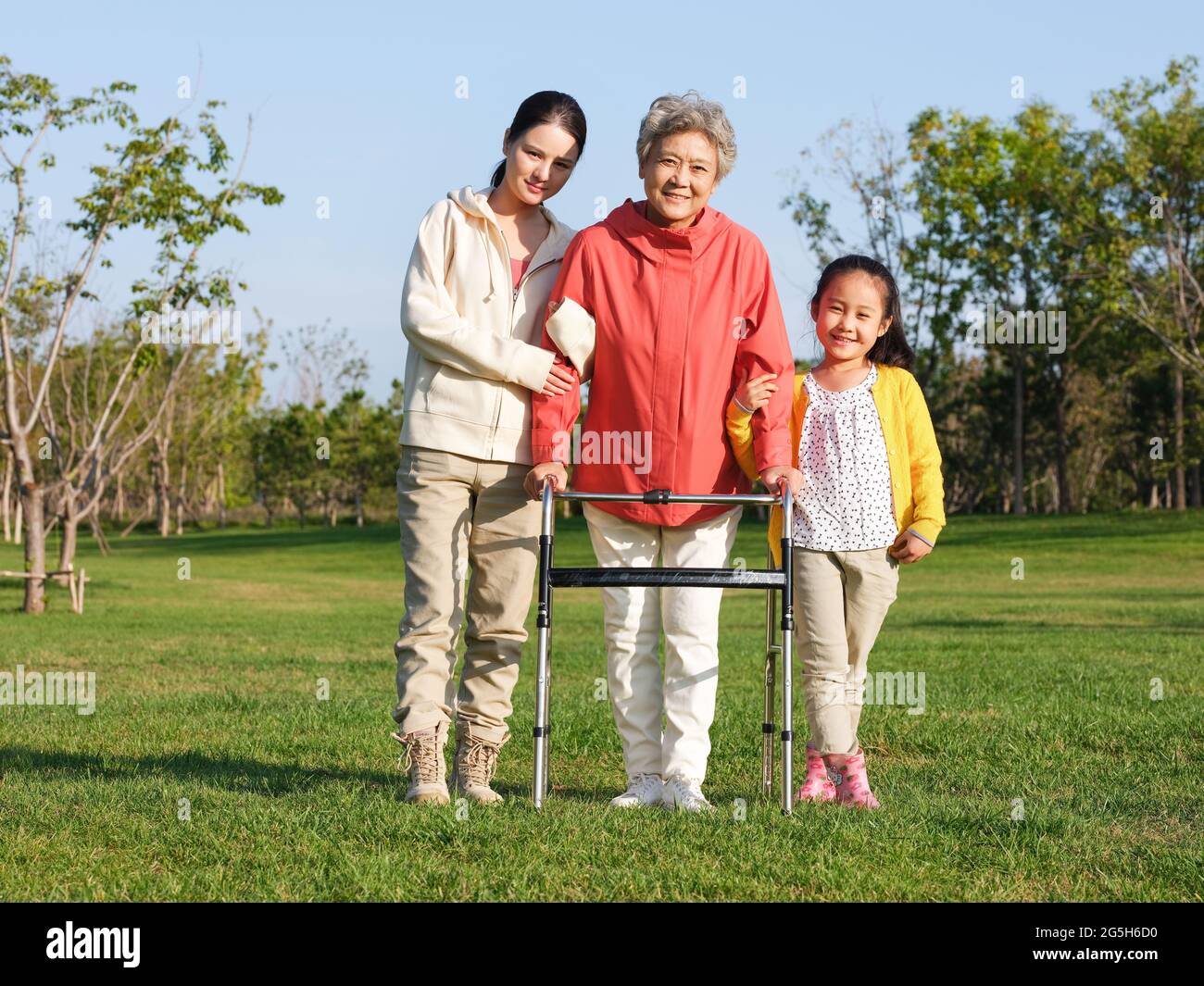 Happy grandparents and grandchildren take a group photo in the park high quality photo Stock Photo