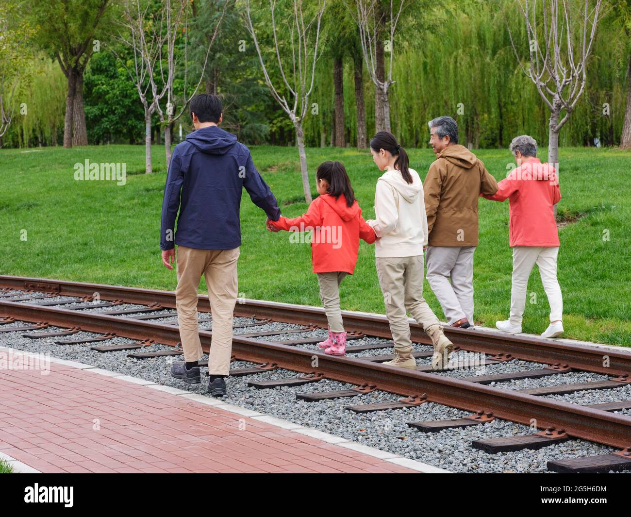 A happy family of five walking outdoors high quality photo Stock Photo