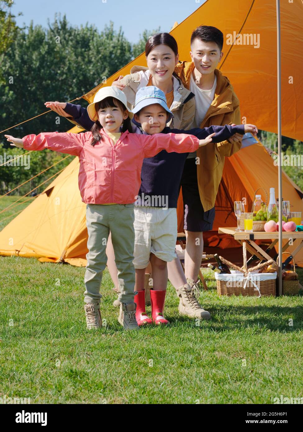 Happy family of four in the park high quality photo Stock Photo - Alamy