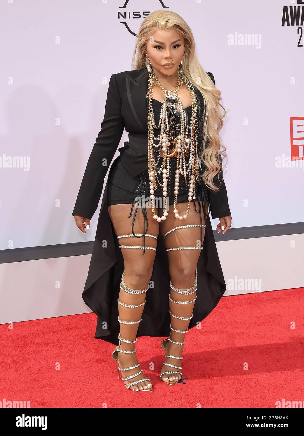 Lil' Kim arrives at the BET Awards 2021 held at the Microsoft Theater