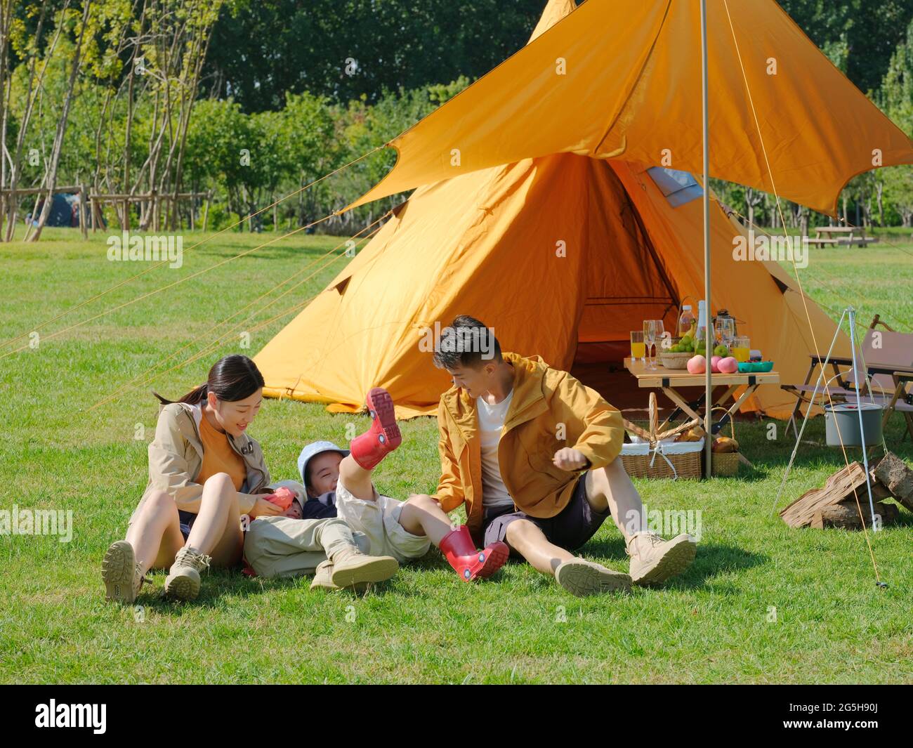 Happy family of four playing in the park high quality photo Stock Photo ...