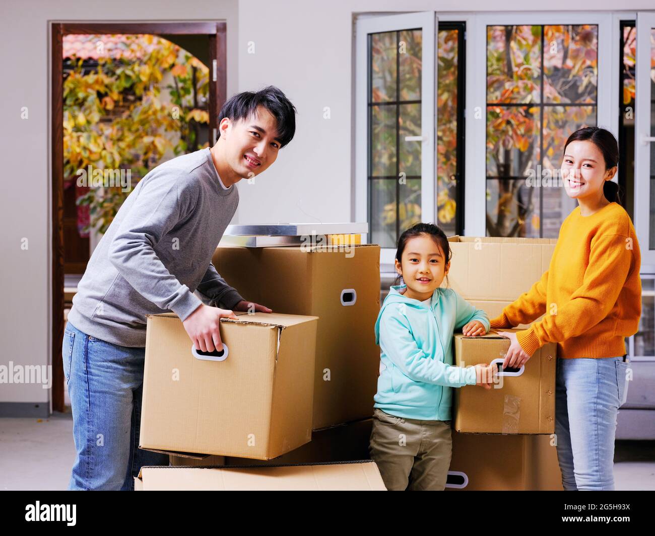 A happy family of three move high quality photo Stock Photo