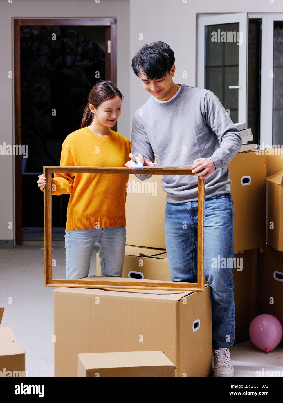 Young couple decorate new home high quality photo Stock Photo