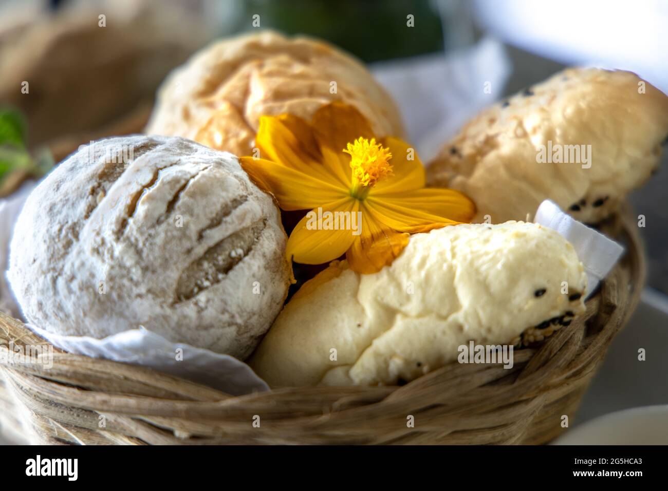 Various breads in the basket at Restaurant Stock Photo