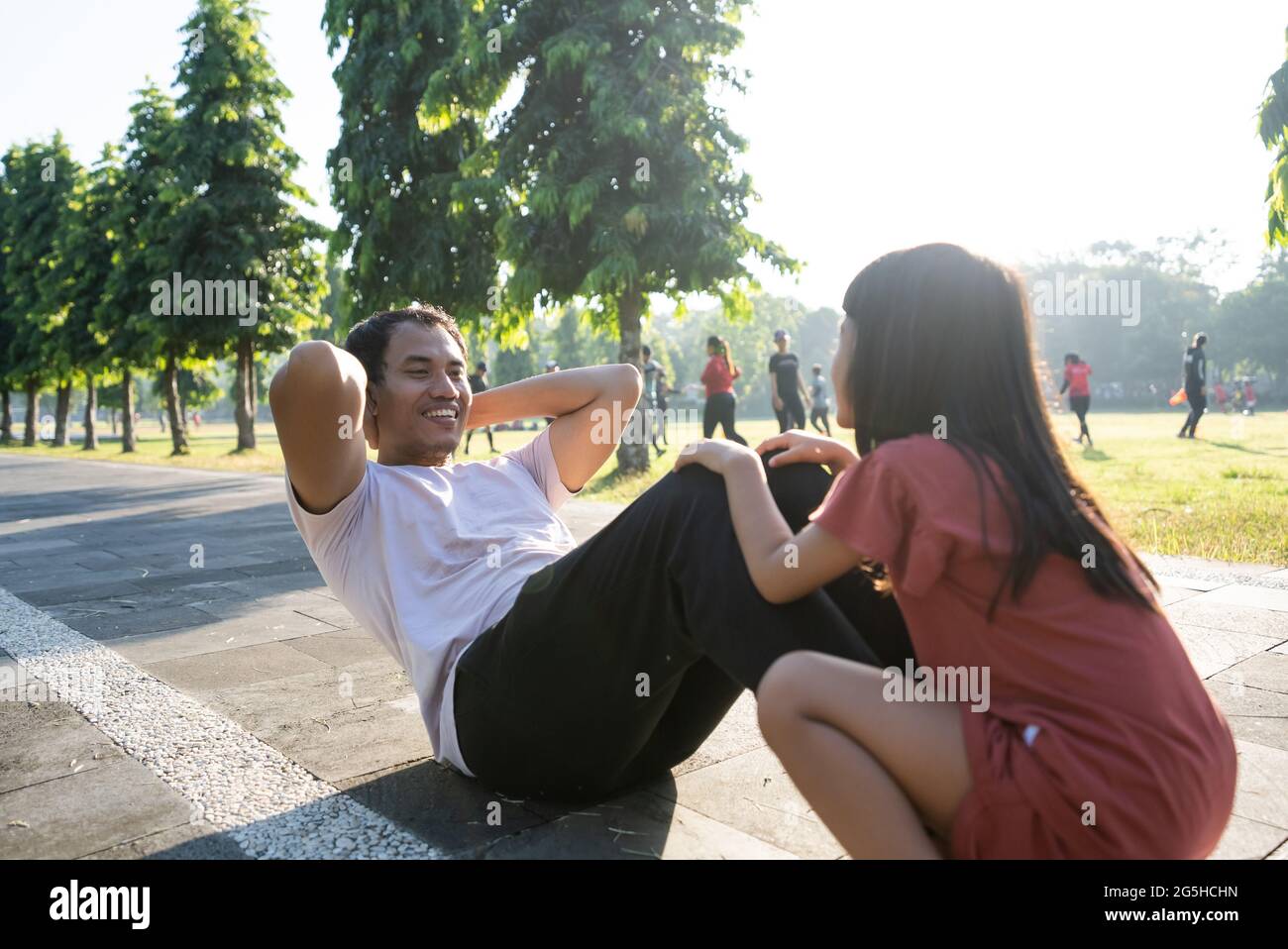 Healthy lifestyle of family with child. dad sit up and child sitting on