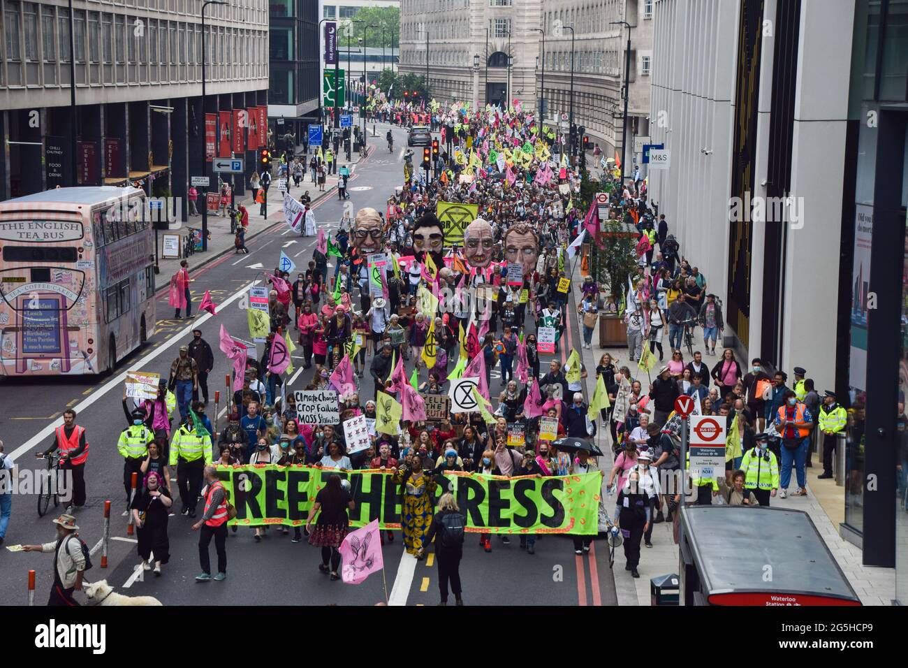 Crowd of demonstrators march through central London during the Free The Press protest.Extinction Rebellion demonstrators marched from Parliament Square to News UK headquarters, owned by Rupert Murdoch, in protest of corruption, and the inaccurate and insufficient coverage of the climate and environmental crisis by several major UK newspapers owned by billionaires. (Photo by Vuk Valcic / SOPA Images/Sipa USA) Stock Photo