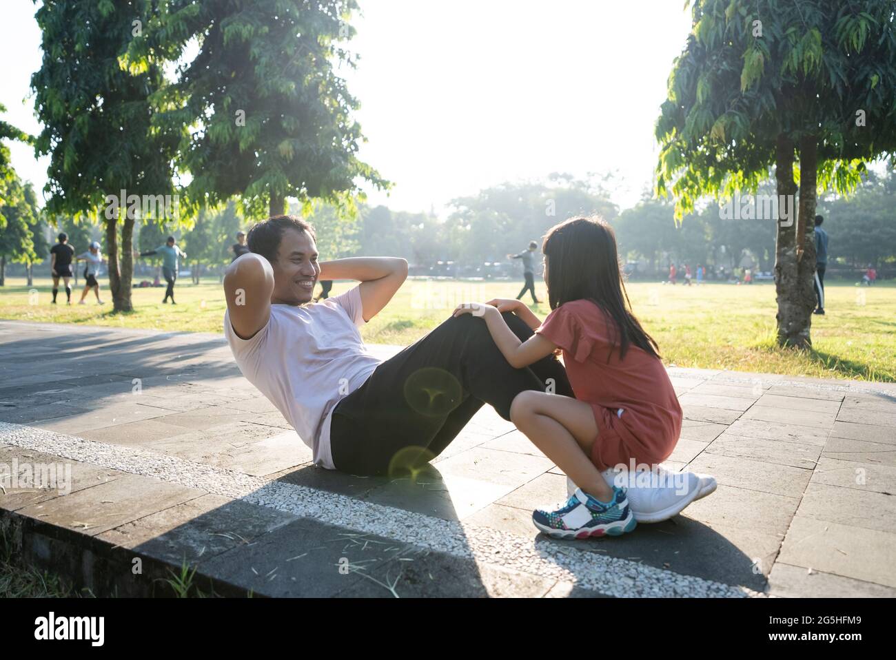Healthy lifestyle of family with child. dad sit up and child sitting on