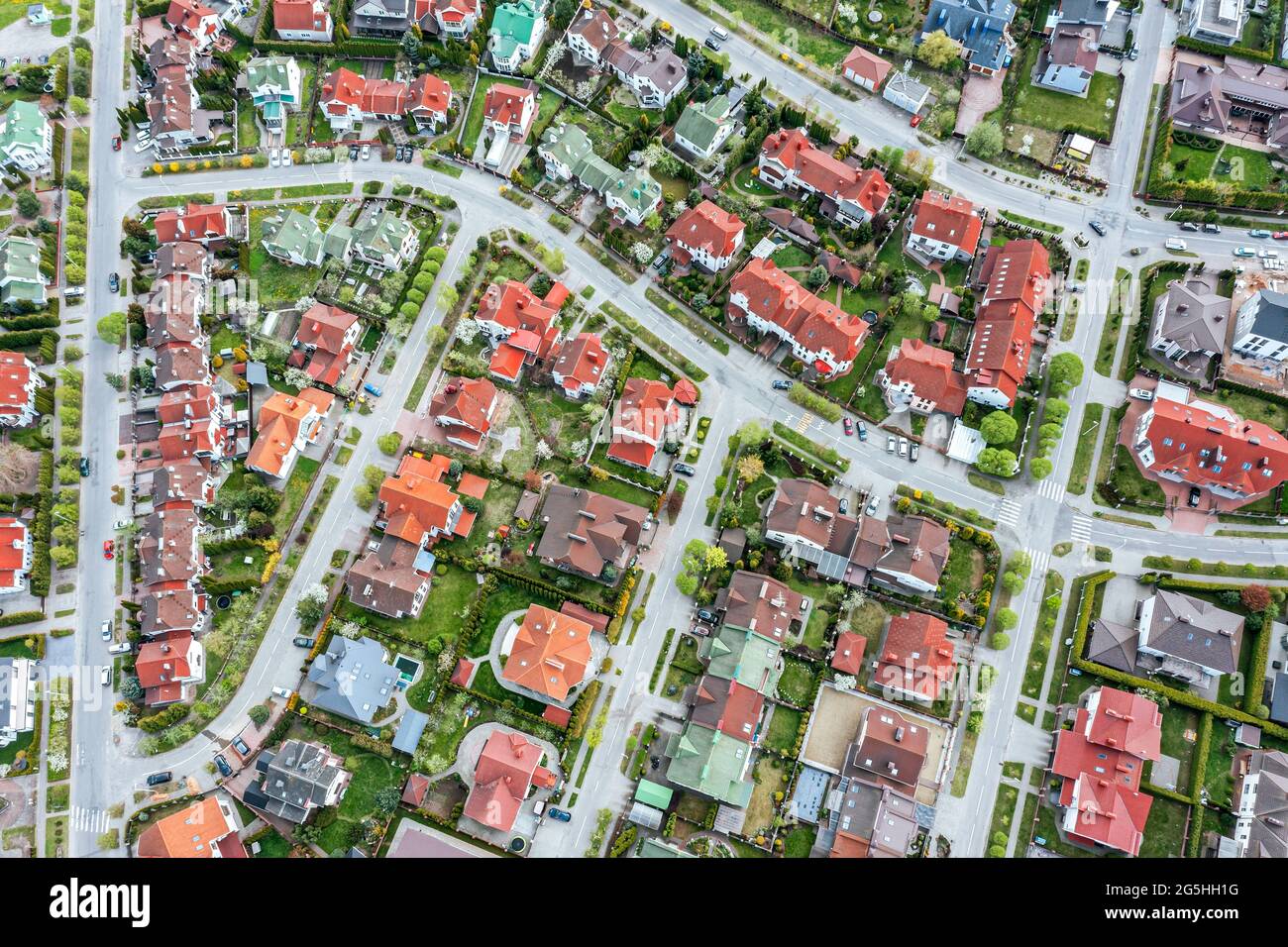 aerial top view of a neighborhood in the suburban area with homes and intersecting streets Stock Photo