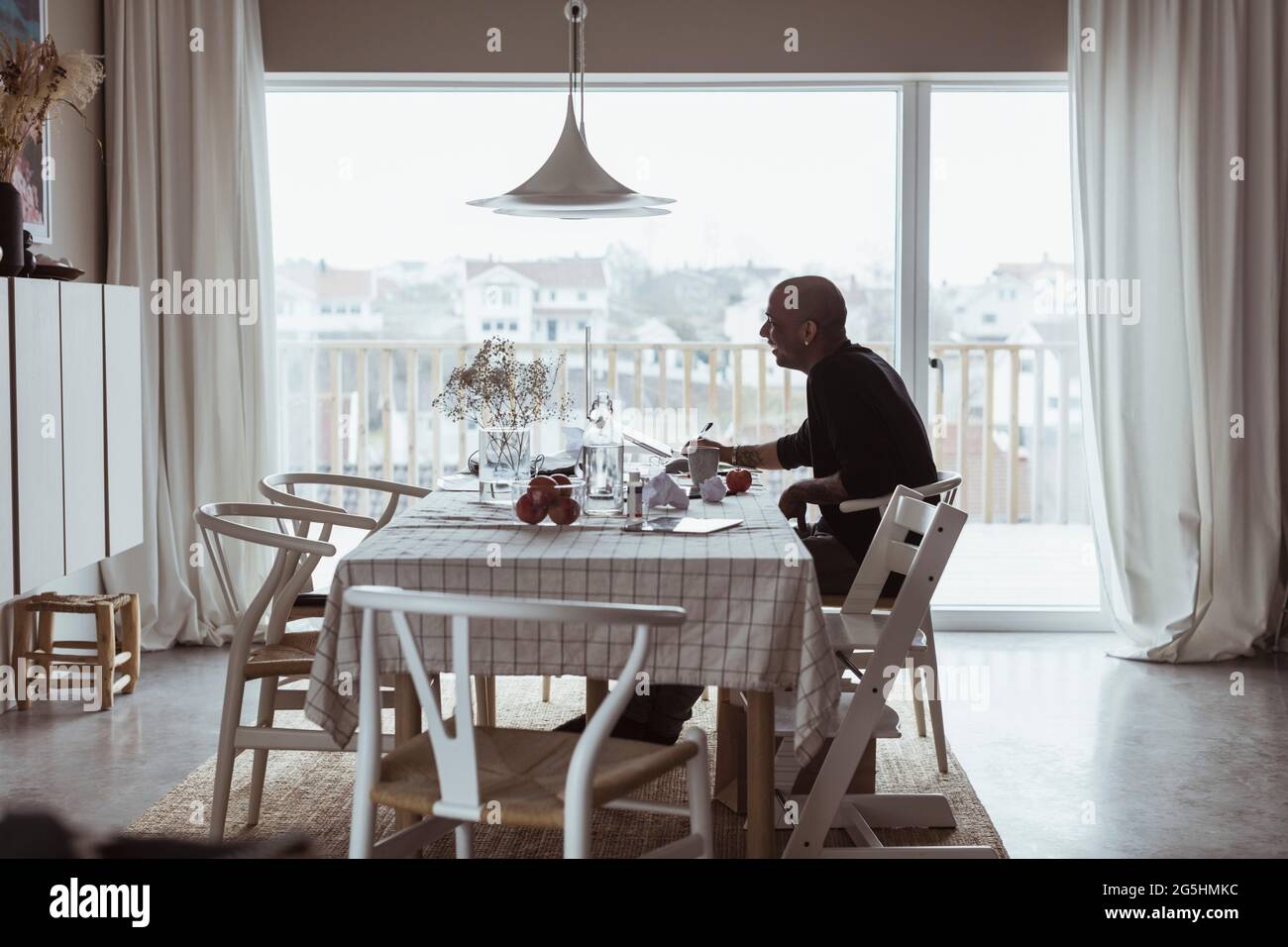 Businessman working on laptop at home Stock Photo