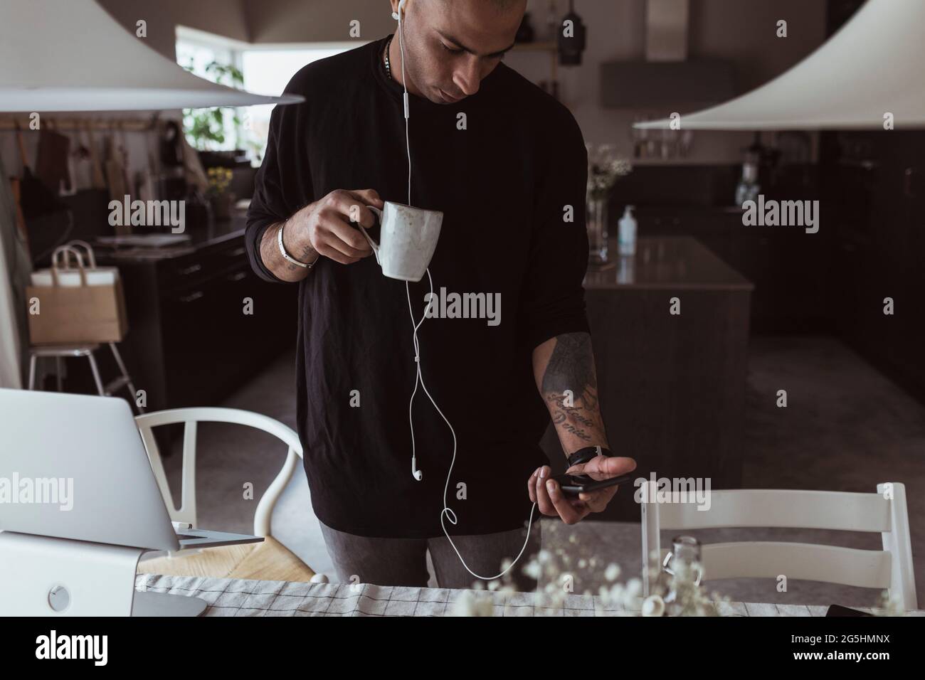 Businessman using smart phone at home Stock Photo