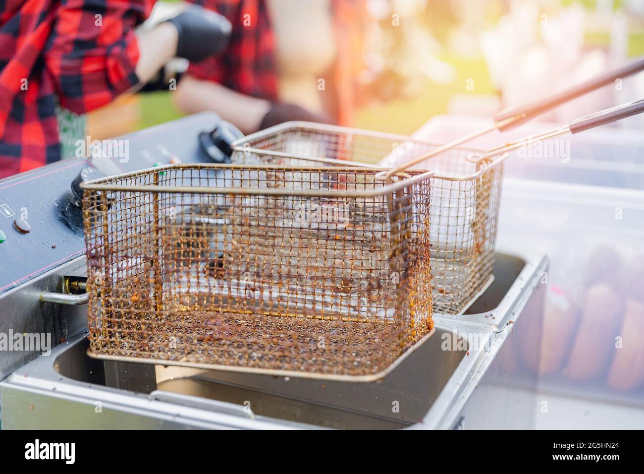 dirty Fryer for potatoes with boiling oil fast food restaurant
