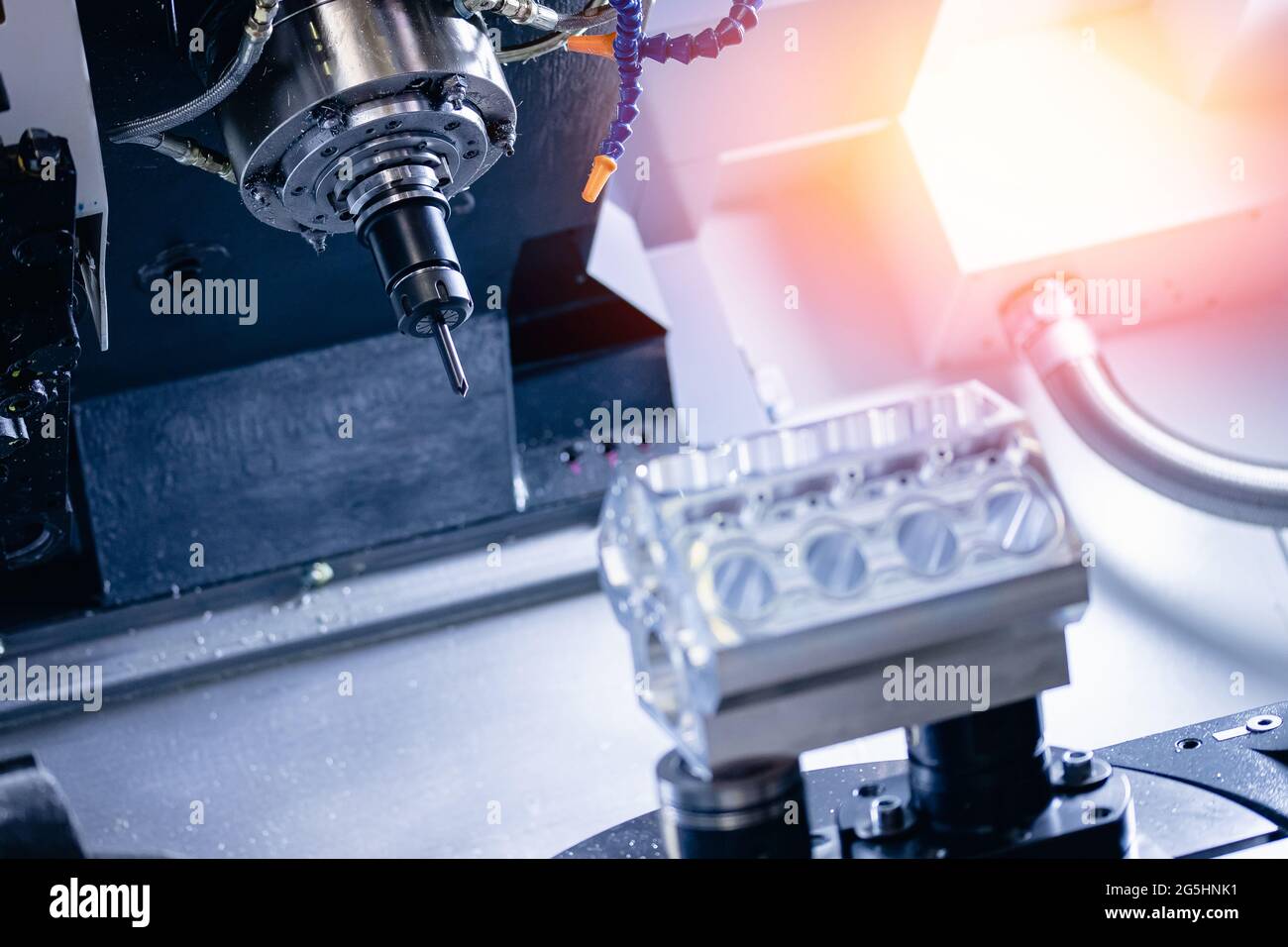 Steel milling CNC Manufacturing process of cylinder block for car engine at modern factory. Stock Photo