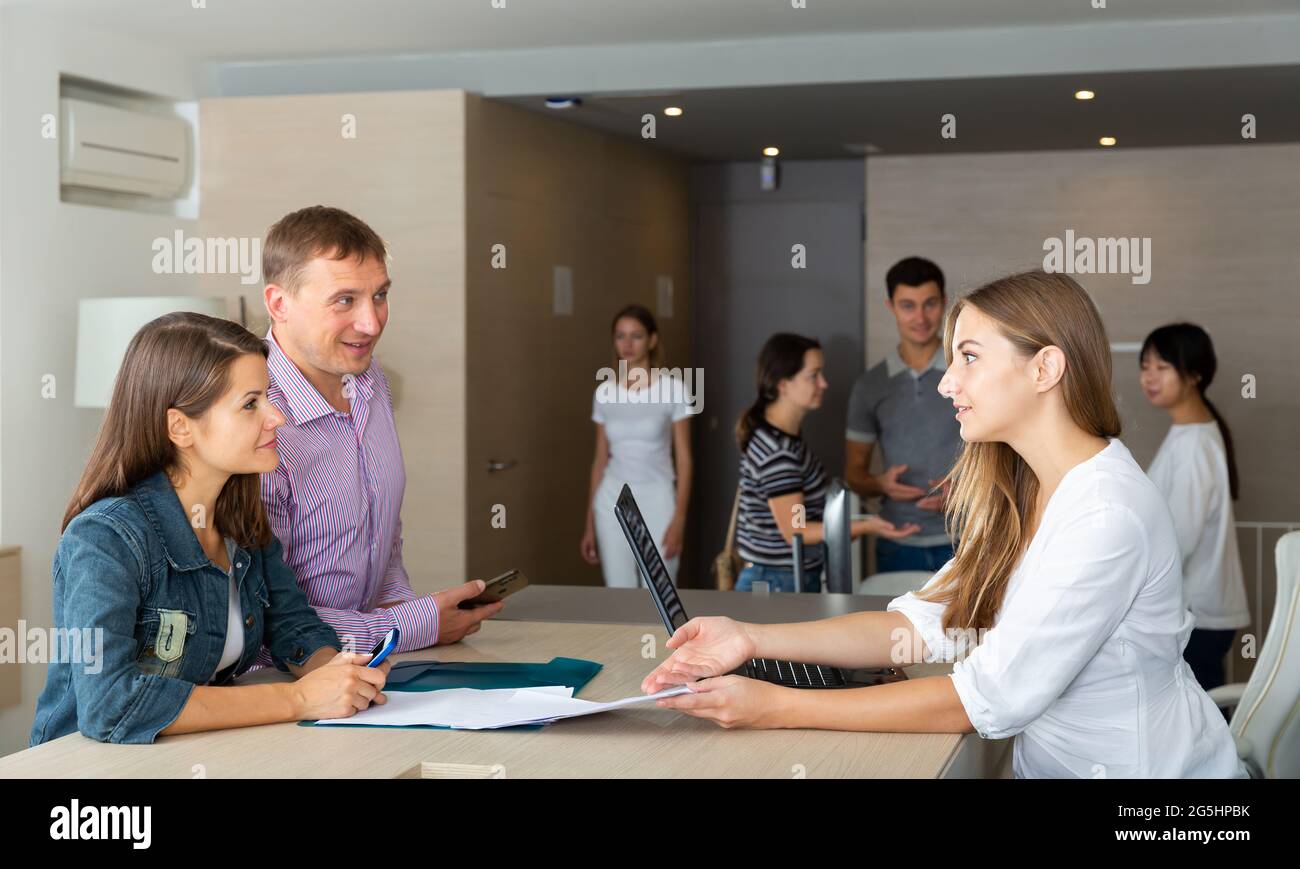 Female lawyer consulting clients in informal office Stock Photo