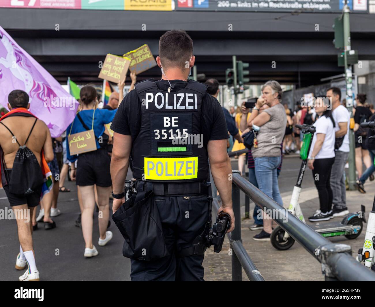 Berlin, Germany - June 26, 2021 - Rear view of a police officer on the sidelines of the Christopher Street Day (CSD) demonstration in Berlin Stock Photo