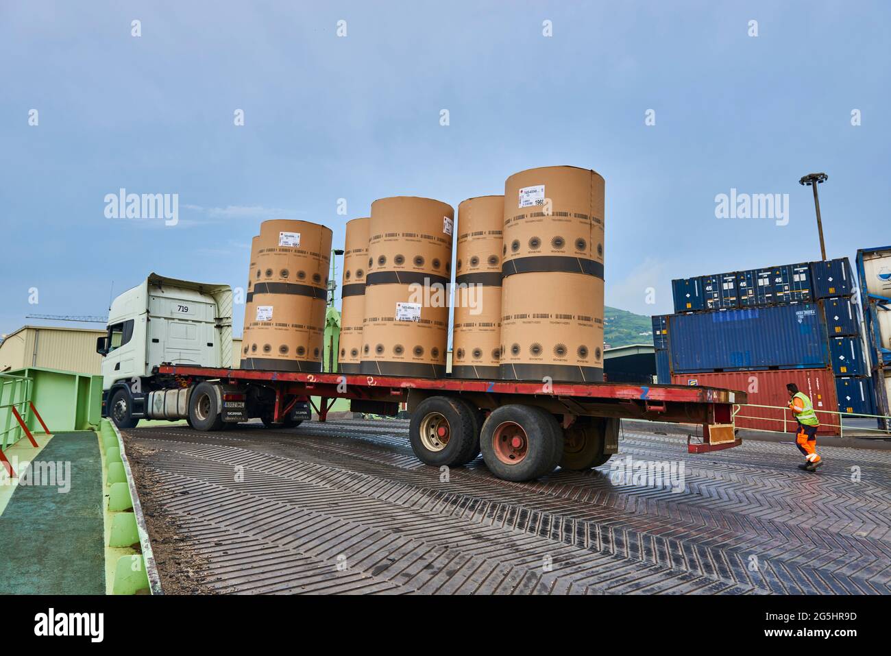 Lorry unloading paper rolls to the vessel in the Port of Bilbao, Biscay ...