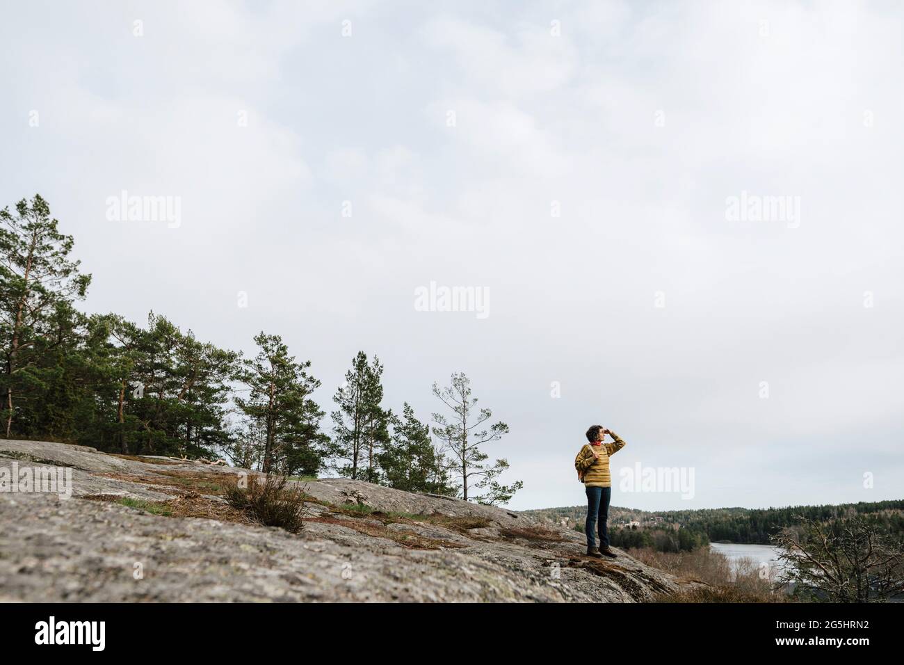 Hiker standing on mountain hi-res stock photography and images - Alamy