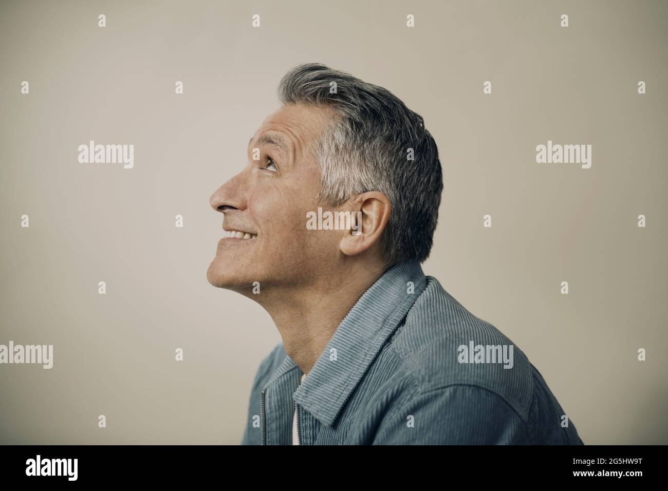 Mature smiling man in gray hi-res stock photography and images - Alamy